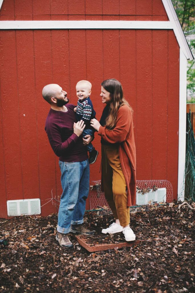 A Family of three enjoying one another on their farm.